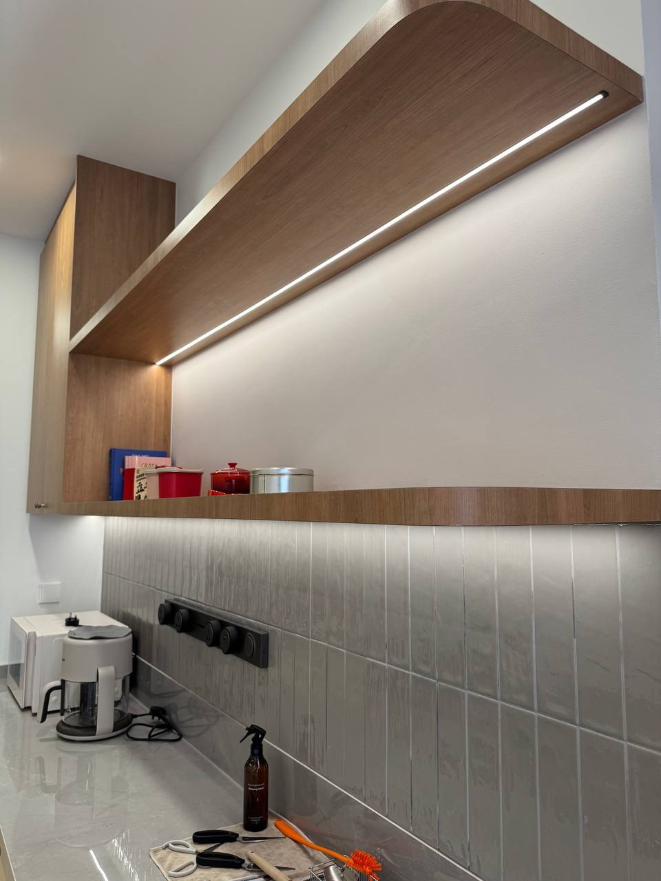 Lower cabinet run with rounded drawer fronts and tictac tile backsplash