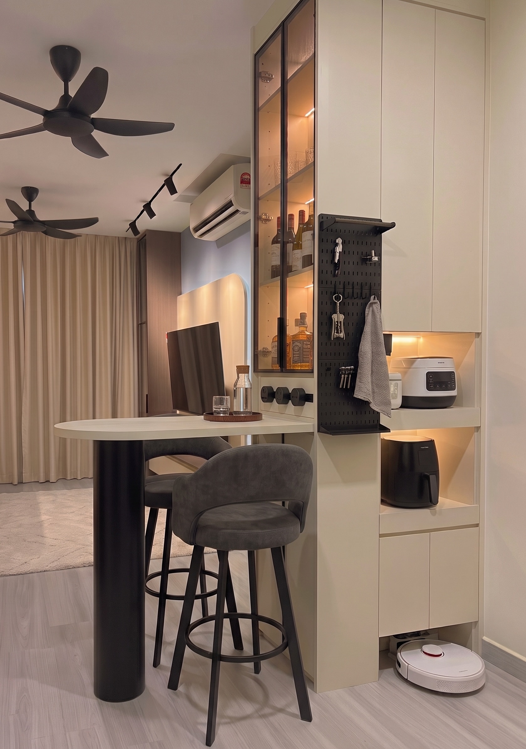 Rounded TV feature wall with LED backlight, smart AC, and track lighting