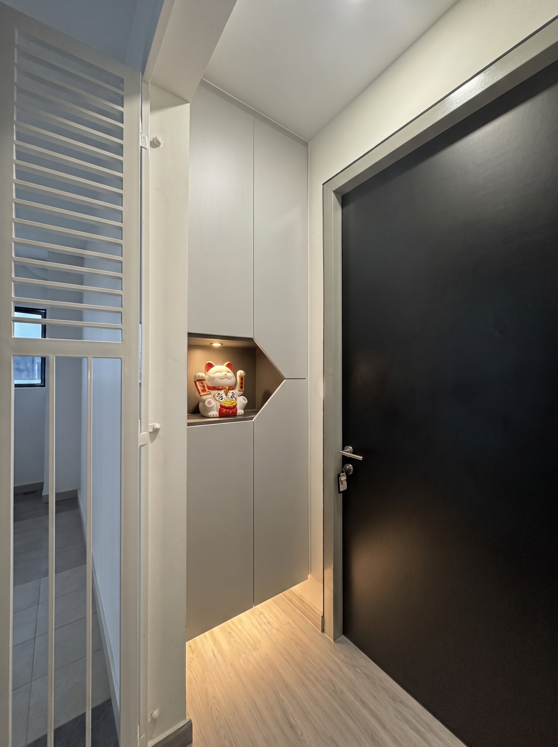 Corridor with V-shaped linear LED ceiling lights leading to bedrooms